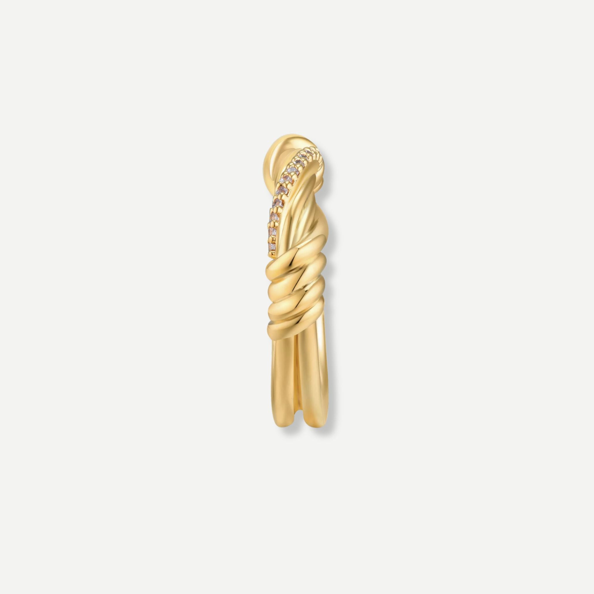 Gold earring with a twisted design on a white background