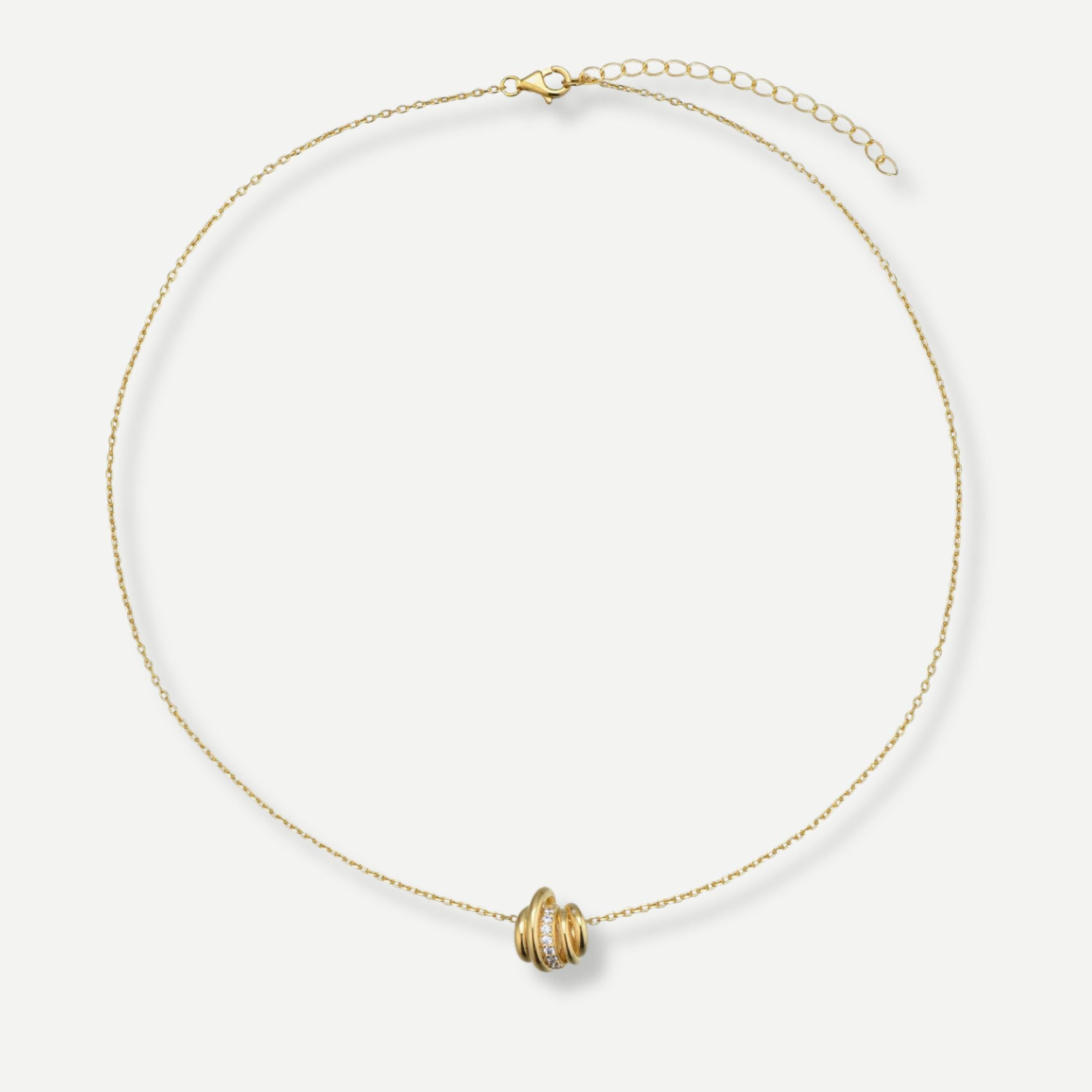 Gold necklace with a unique pendant on a white background