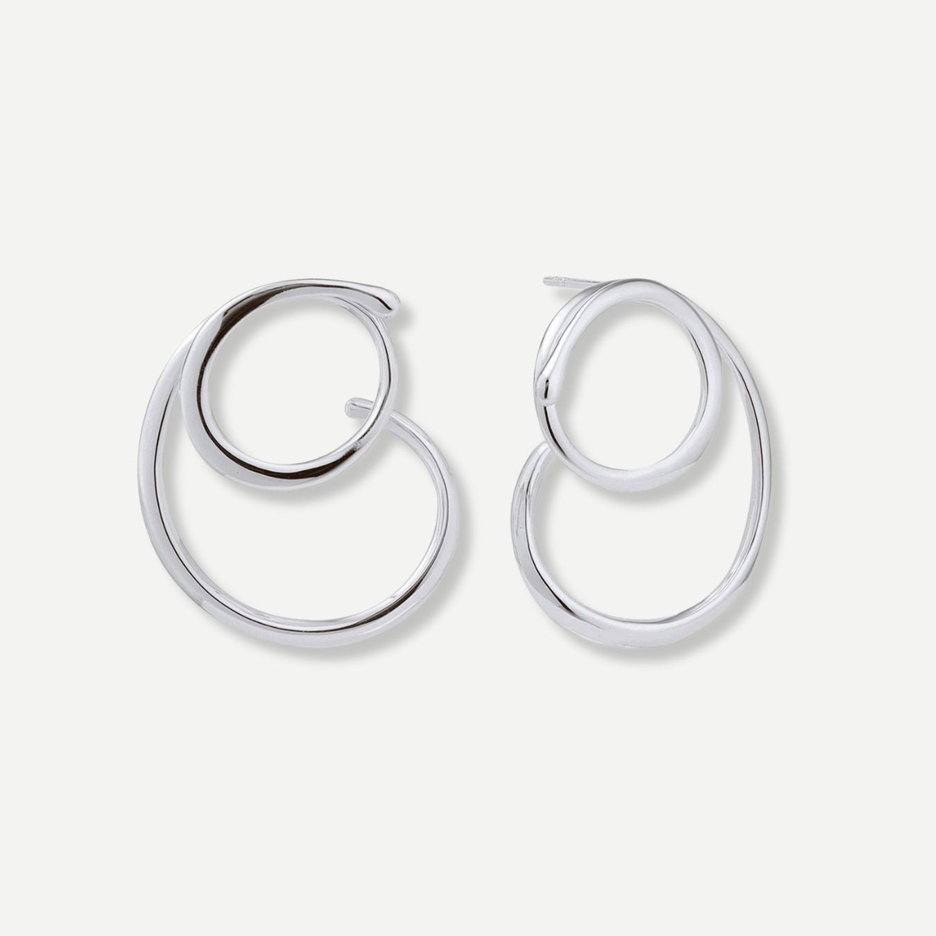 Pair of silver hoop earrings on a white background